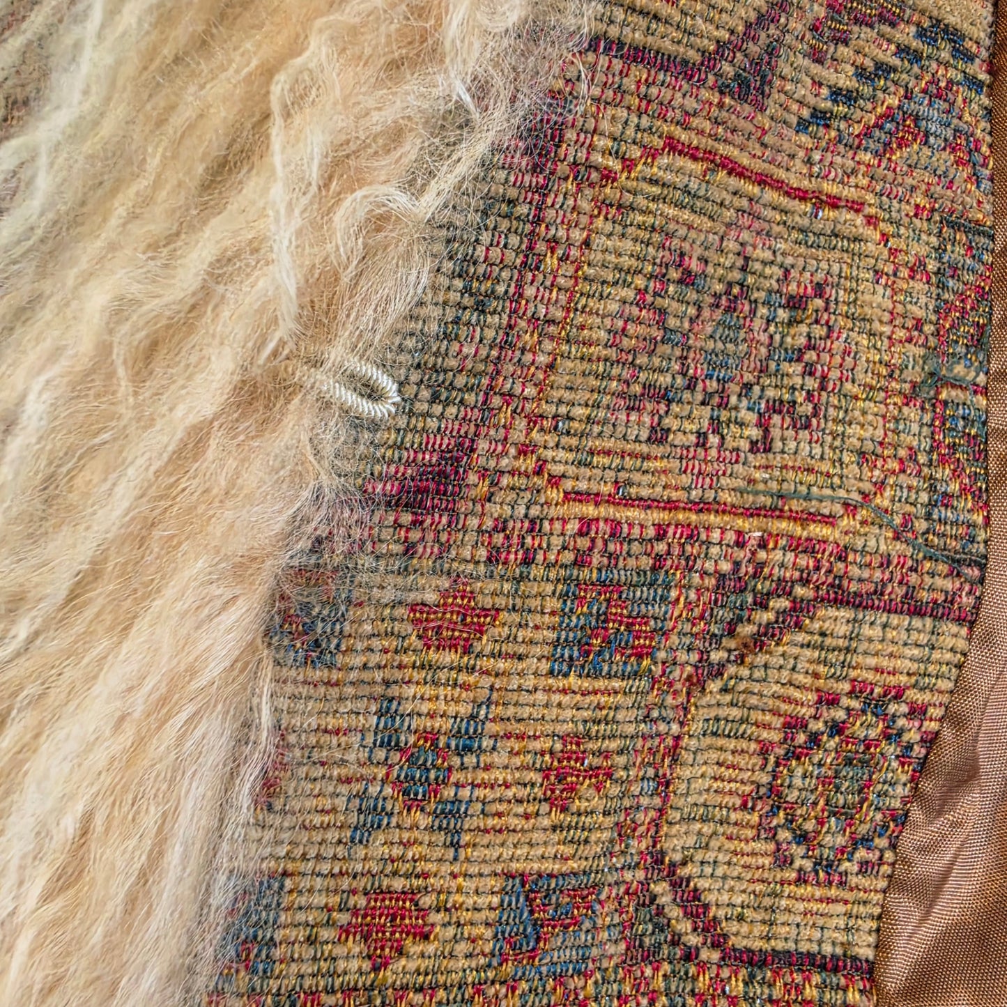 Close up of the eyelet closure, the bohemain fabric & fur trim on the Vintage Penny Lane Tapestry coast