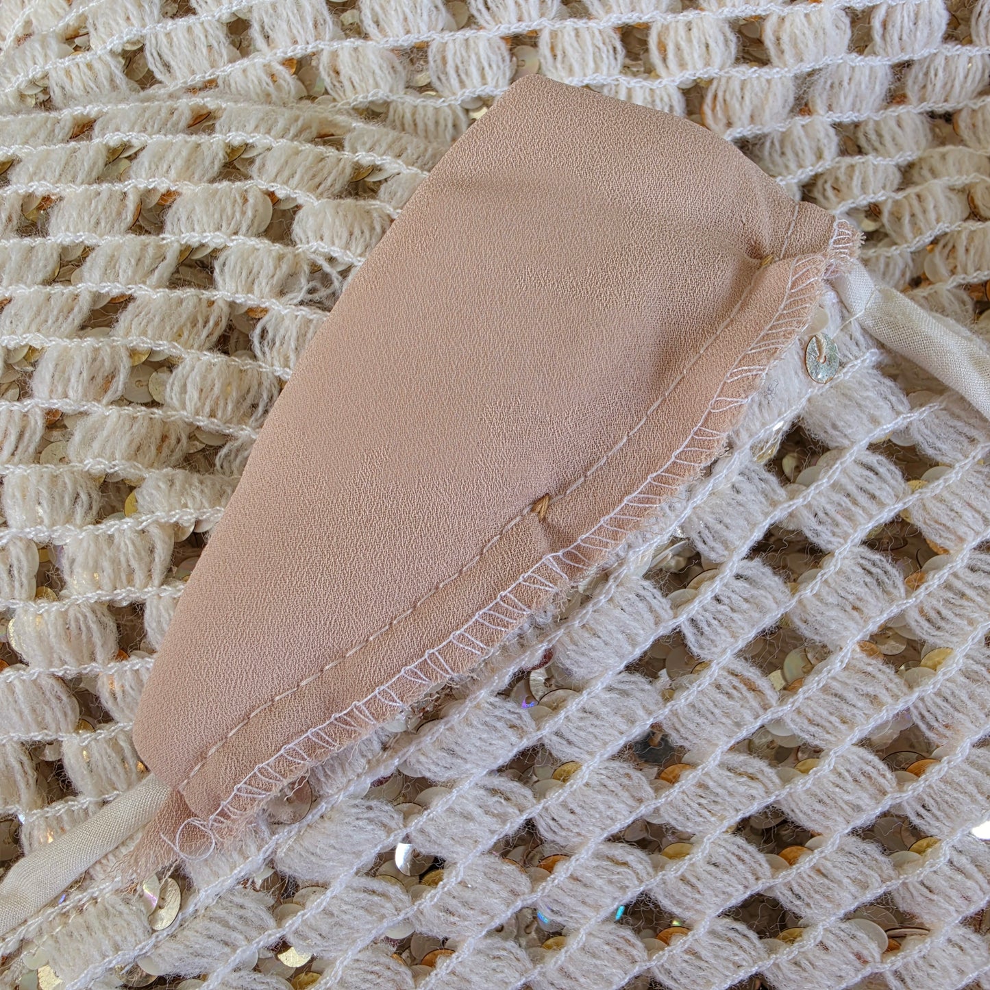 Image showing a close up view of the cap style lshoulder pads on the vintage sequin jacket