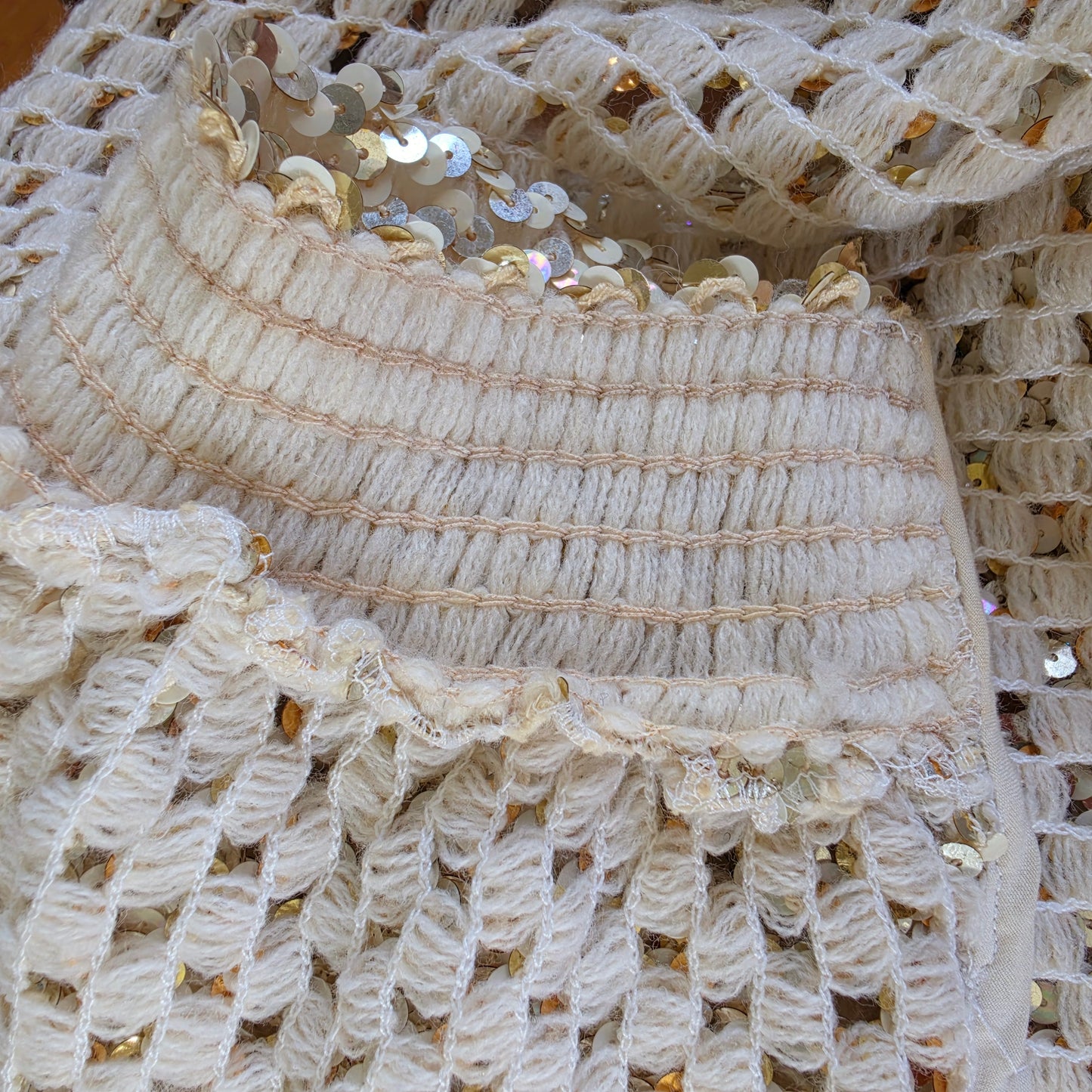 Close up view of the inside sleeve , showing the againg elastic on the vintage sequin jacket
