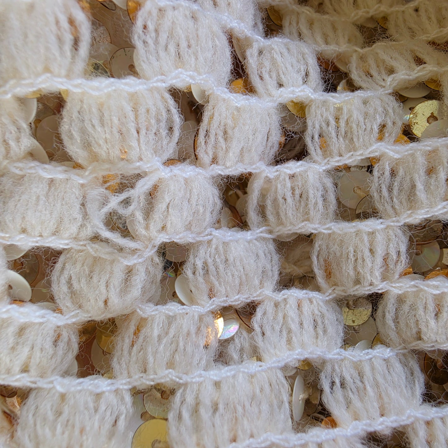 Close up of the threads on the lattice weave, showing some twisted threads from age and wear