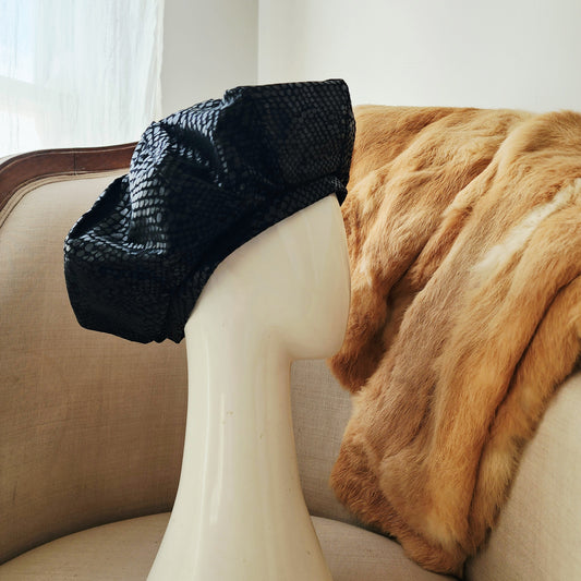 Vintage serpent-print suede beret with structured oversized silhouette.