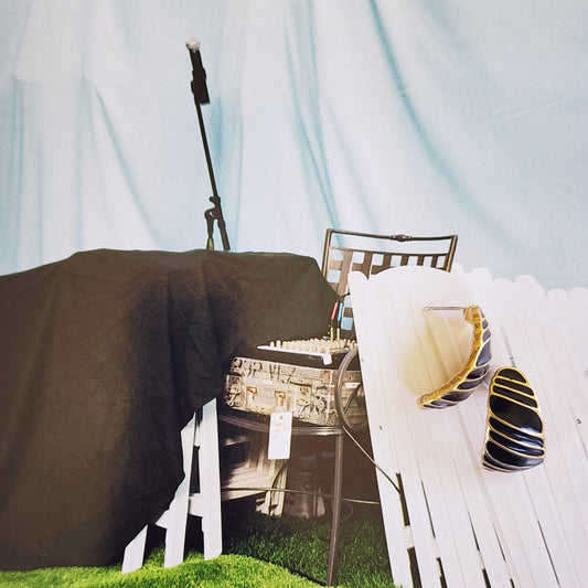 Image showing the vintage Trifari gold and black earrings, showing the gold through black stripe design