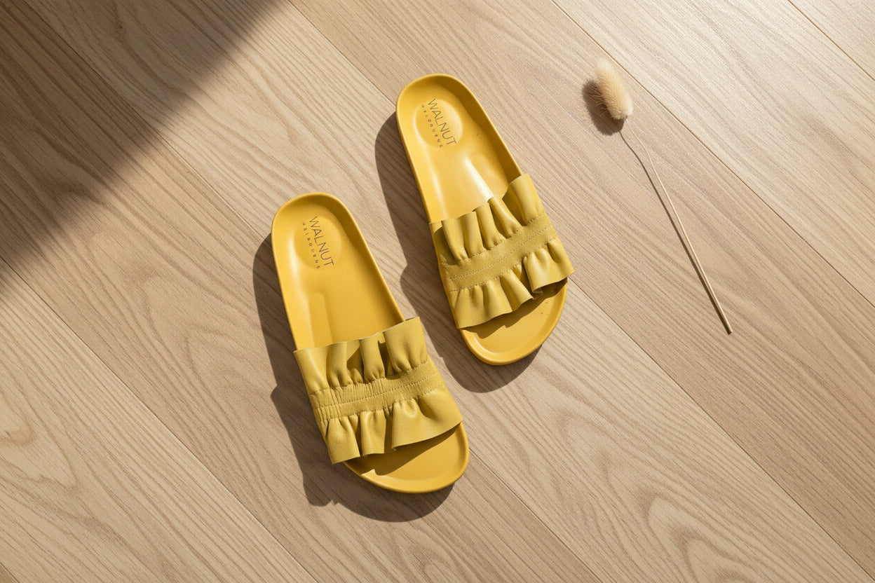 Top view of the Walnut Melbourne yellow slides showing the gathered top and soft leather sole.